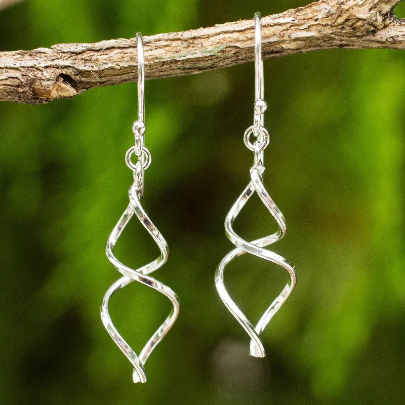 Hoop earrings with artistic filigree designs for an intricate, delicate finish-Lotus Whirl Sterling Silver Artisan Crafted Earrings from Thailand